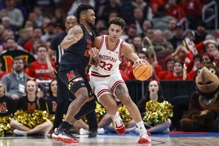 Maryland Terrapins forward Donta Scott (24) defends against Indiana Hoosiers forward Trayce Jackson-Davis (23).